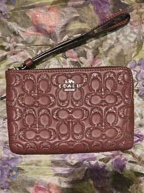 Coach Embossed Signature Wristlet in Burgundy Brown